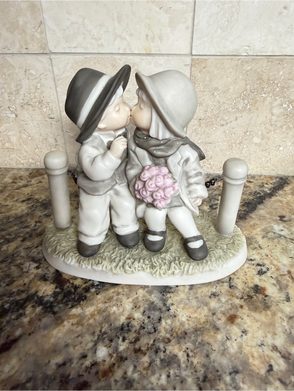 Neutral Gray Ceramic Kissing Children Figurine with Pink Bouquet